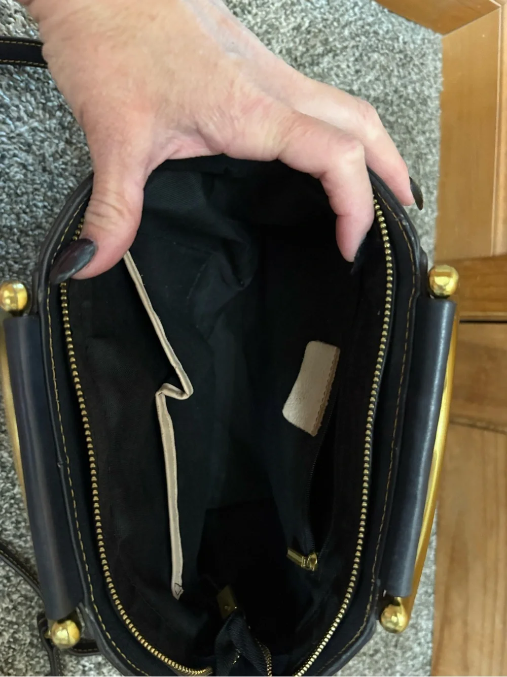Source Unknown Black Leather Shoulder Bag with Gold Embossed Medallion